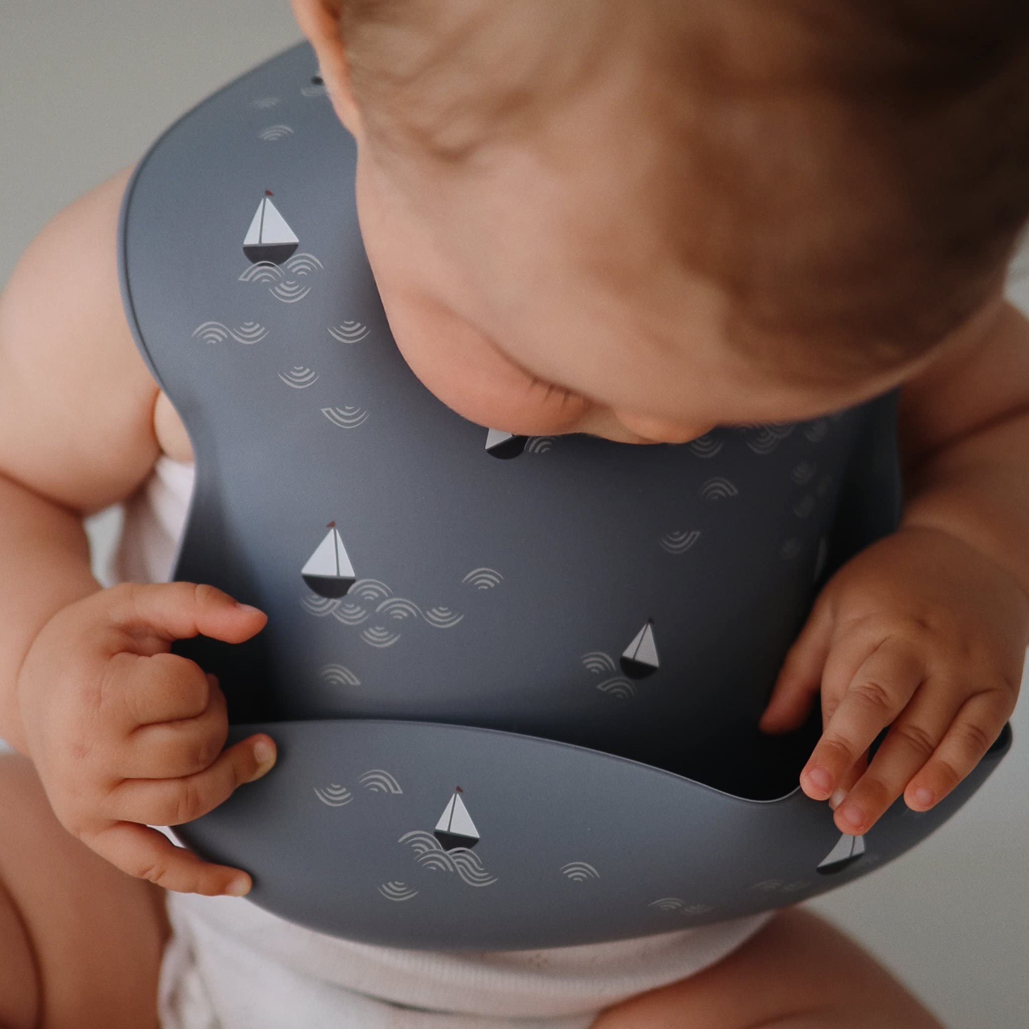 mushie Silicone Baby Bib | Adjustable Fit Waterproof Bibs (Whales)