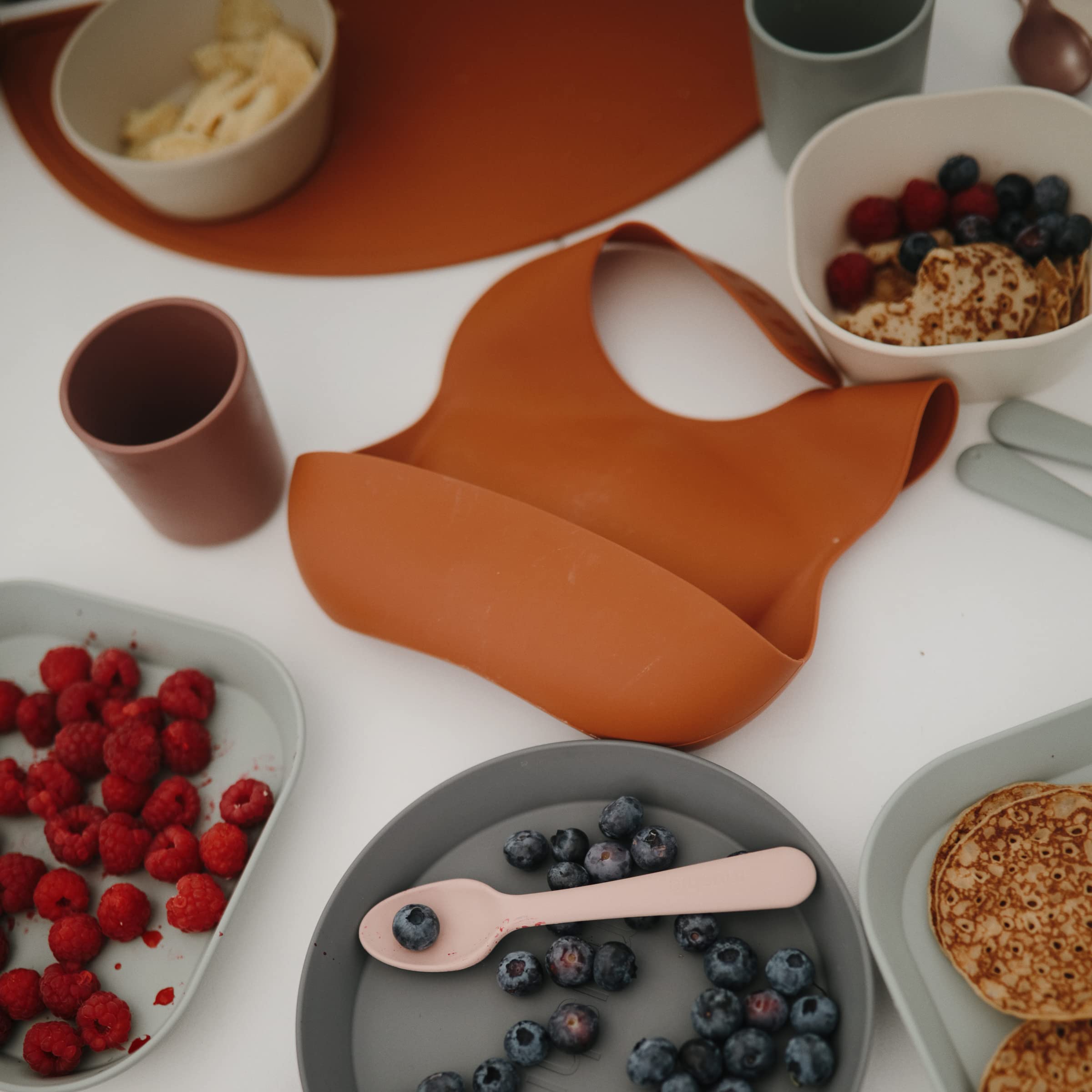 mushie Silicone Baby Bib | Adjustable Fit Waterproof Bibs (Whales)