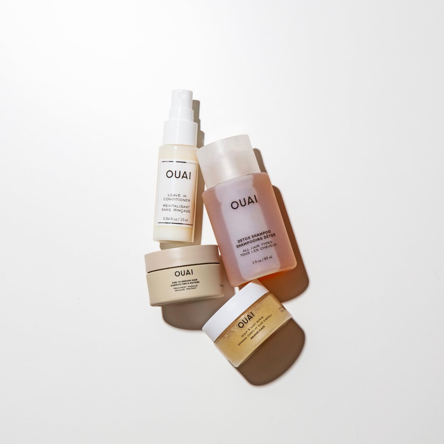 OUAI Travel Kit - Includes Travel Size Leave In Conditioner, Detox Shampoo, Fine to Medium Hair Mask, Scalp &amp; Body Scrub - Travel Size Stocking Stuffers for Women (4 Count)