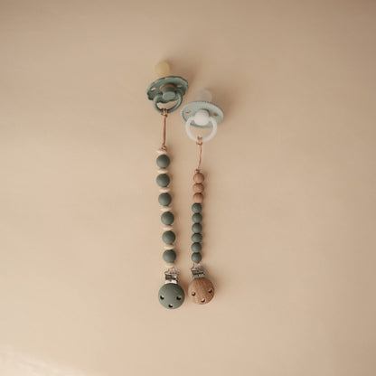 mushie 100% Silicone Baby Pacifier Clip BPA Free | Luna (Faux Wood)