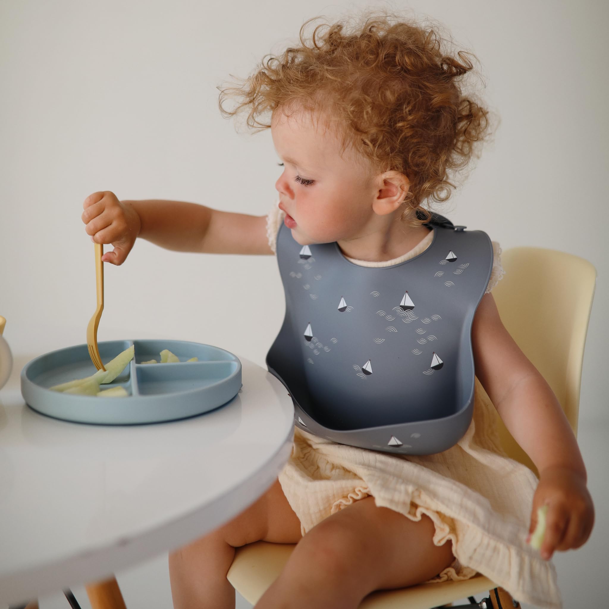 mushie Silicone Baby Bib | Adjustable Fit Waterproof Bibs (Whales)